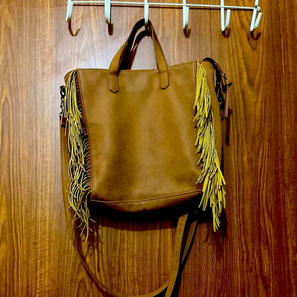 Brown posh bag with dangling strings.